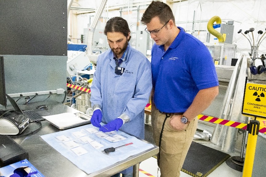 INL and Lightbridge team inspecting the finished enriched uranium-zirconium coupon samples