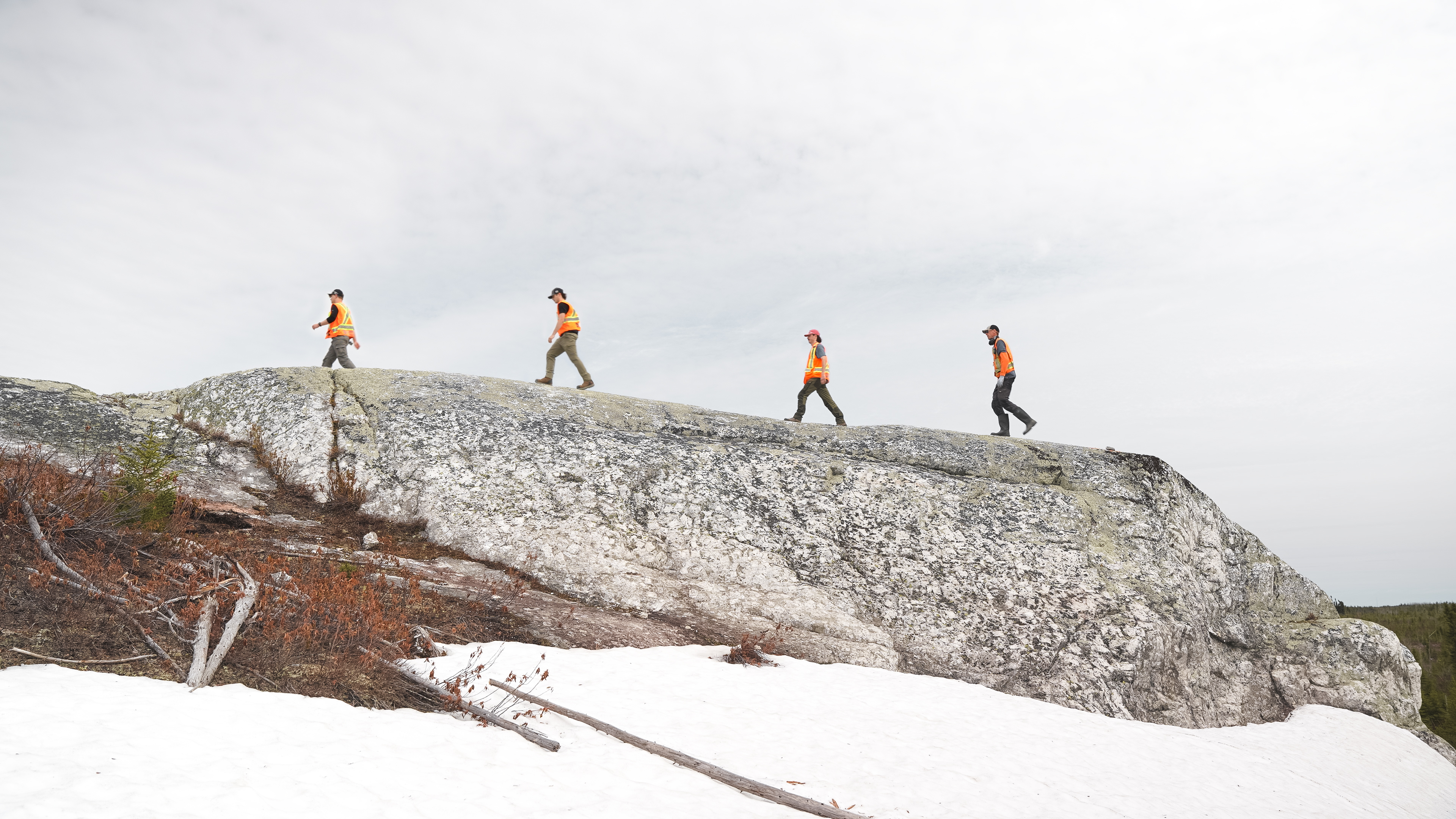 Geologists Walking Across the CO1 Outcrop at the Cisco Lithium Project 