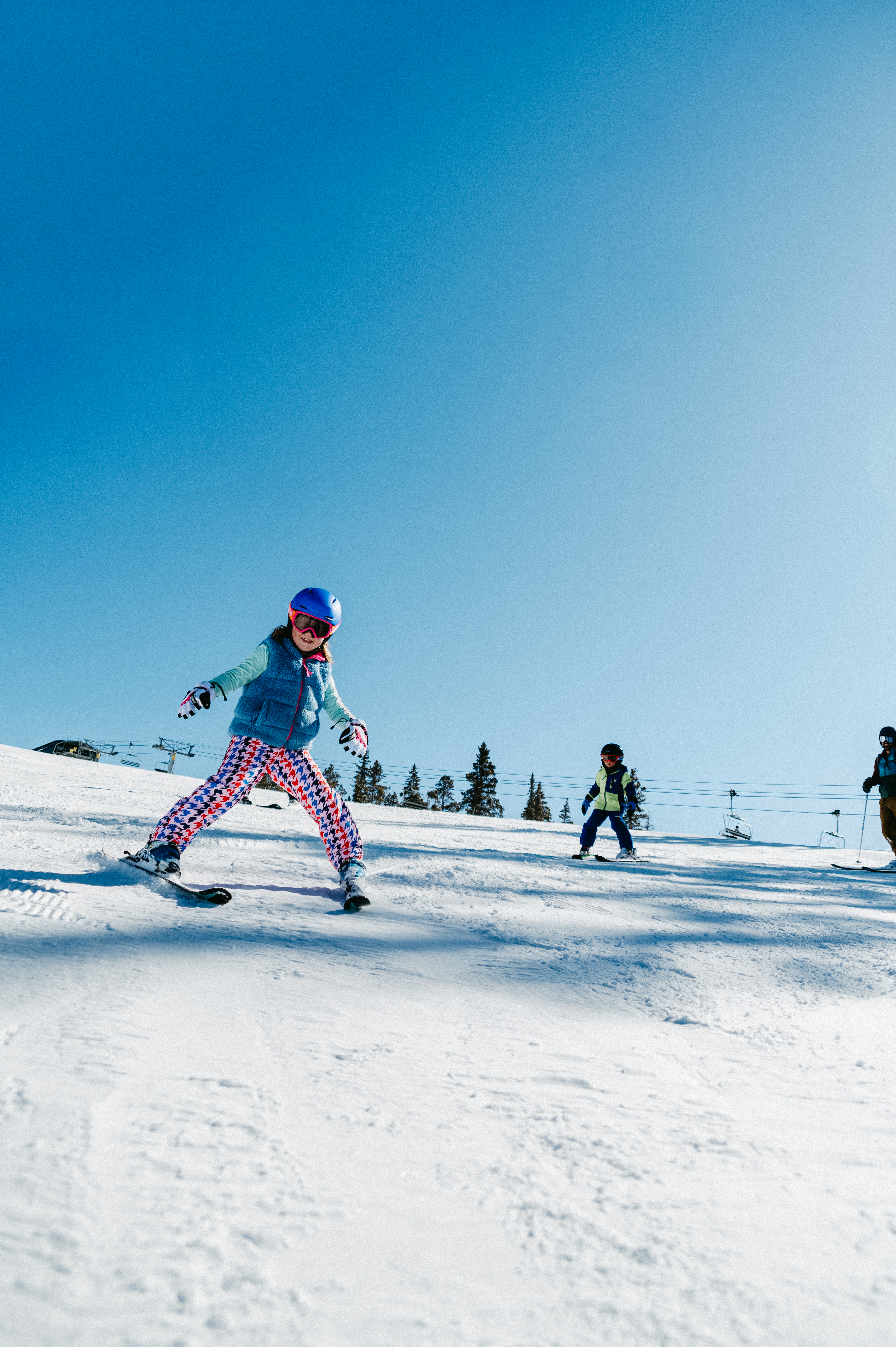 Family skiing on the slopes at Keystone with season gear rentals from Christy Sports