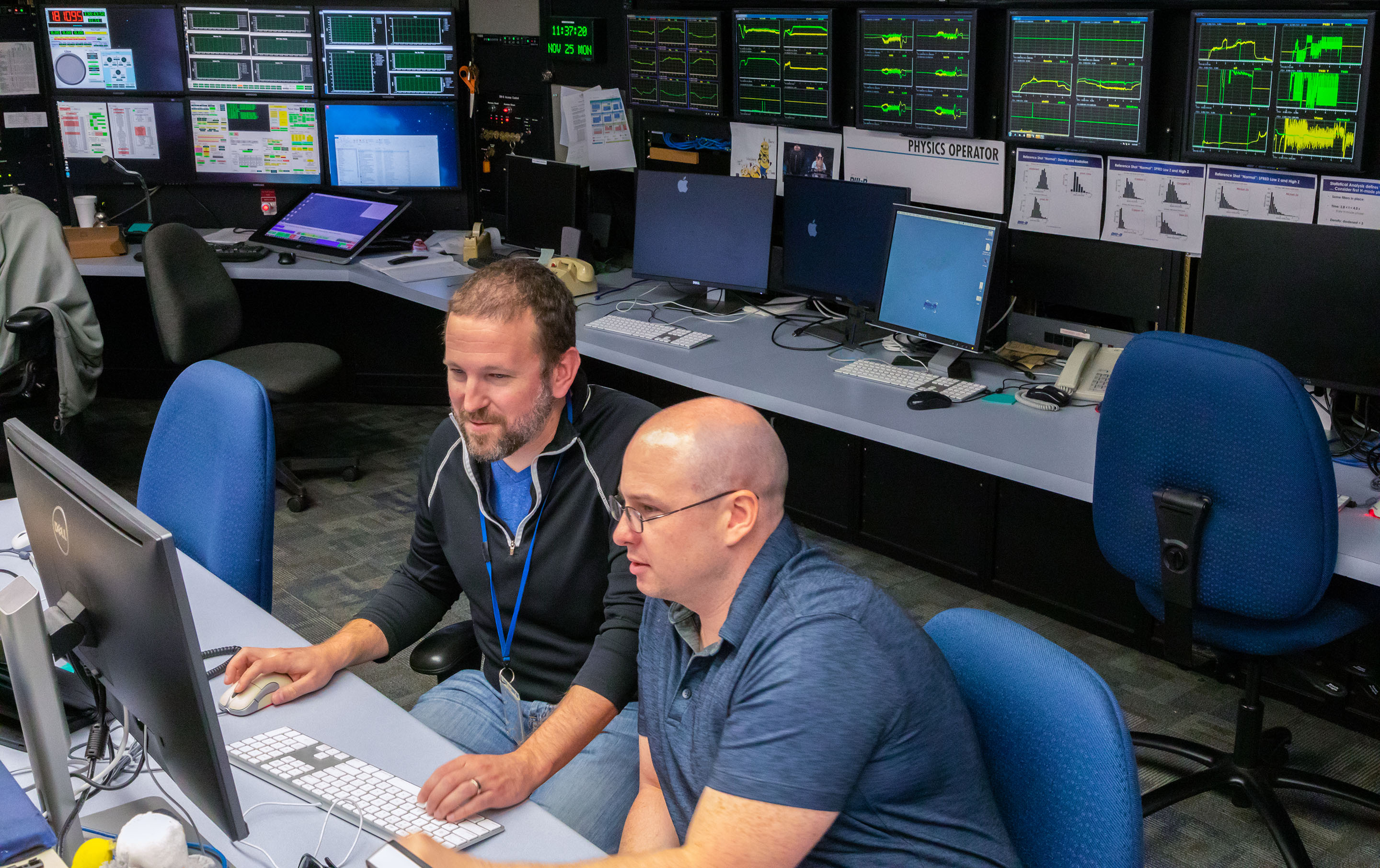 General Atomics researchers Brian Sammuli (left) and Jayson Barr (right) developed an innovative machine learning–based control system that can optimize fusion plasma performance far faster than previous methods. The system was trained using data from decades of research at the DIII-D National Fusion Facility in San Diego. Courtesy General Atomics 