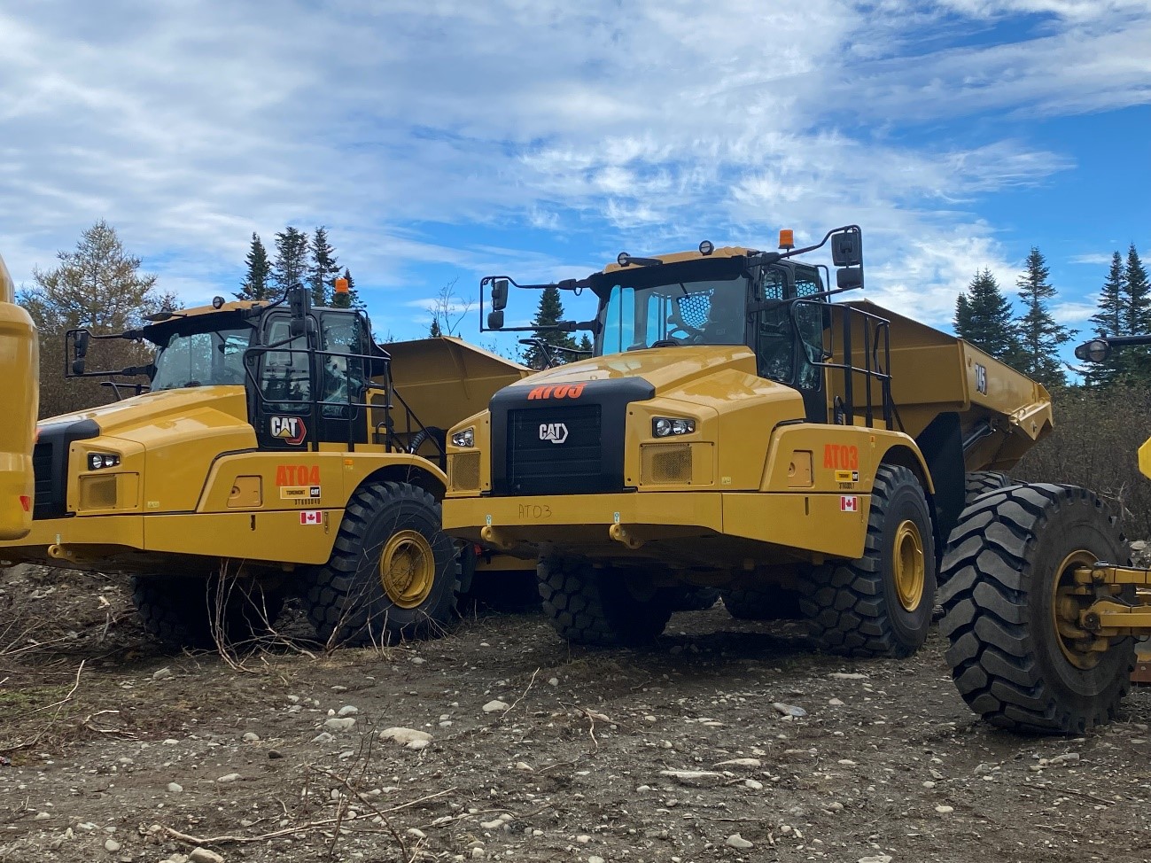 Caterpillar 349 excavator (top) and two Caterpillar 745 45t articulated haul trucks (bottom)