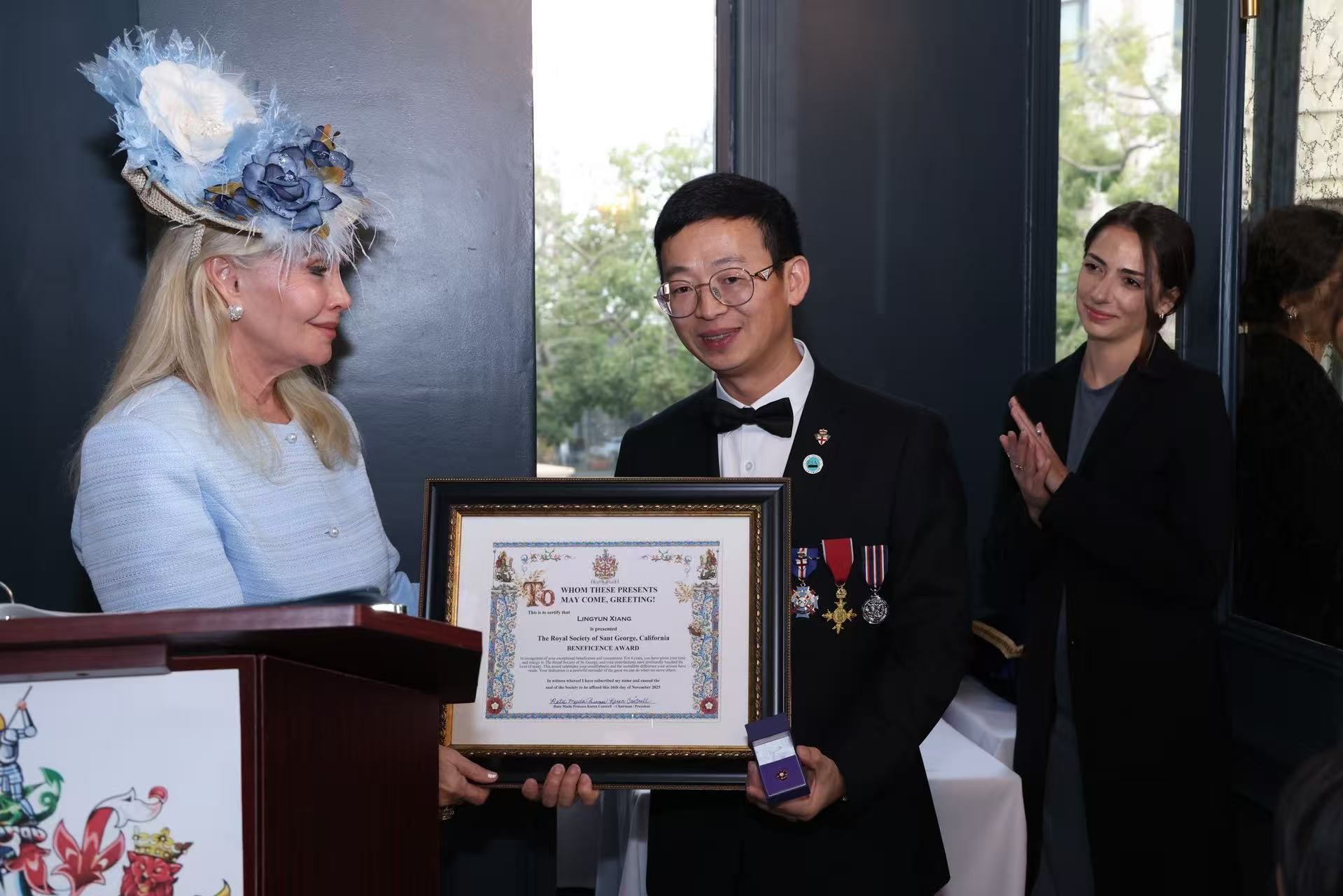 Princess Karen Cantrell presents the prestigious Beneficence Award to Dr. Lingyun Xiang during the ceremony