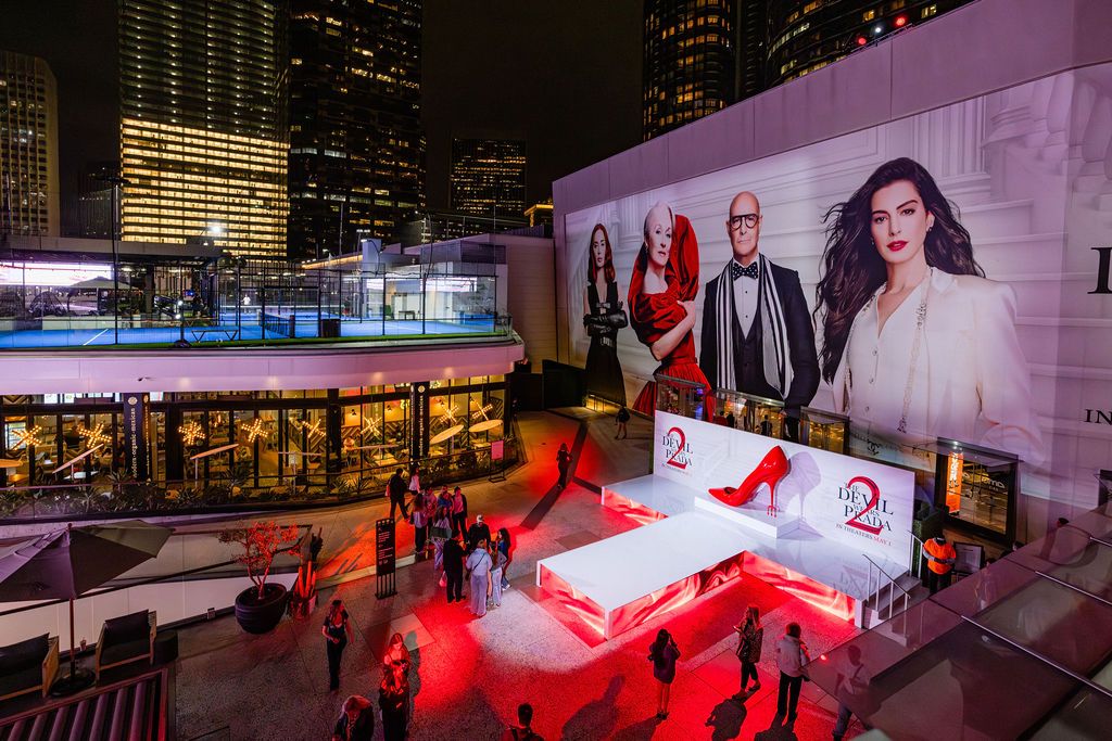 AMC Plaza at Westfield Century City transformed with The Devil Wears Prada 2 visuals, featuring a Runway Magazine-style façade.