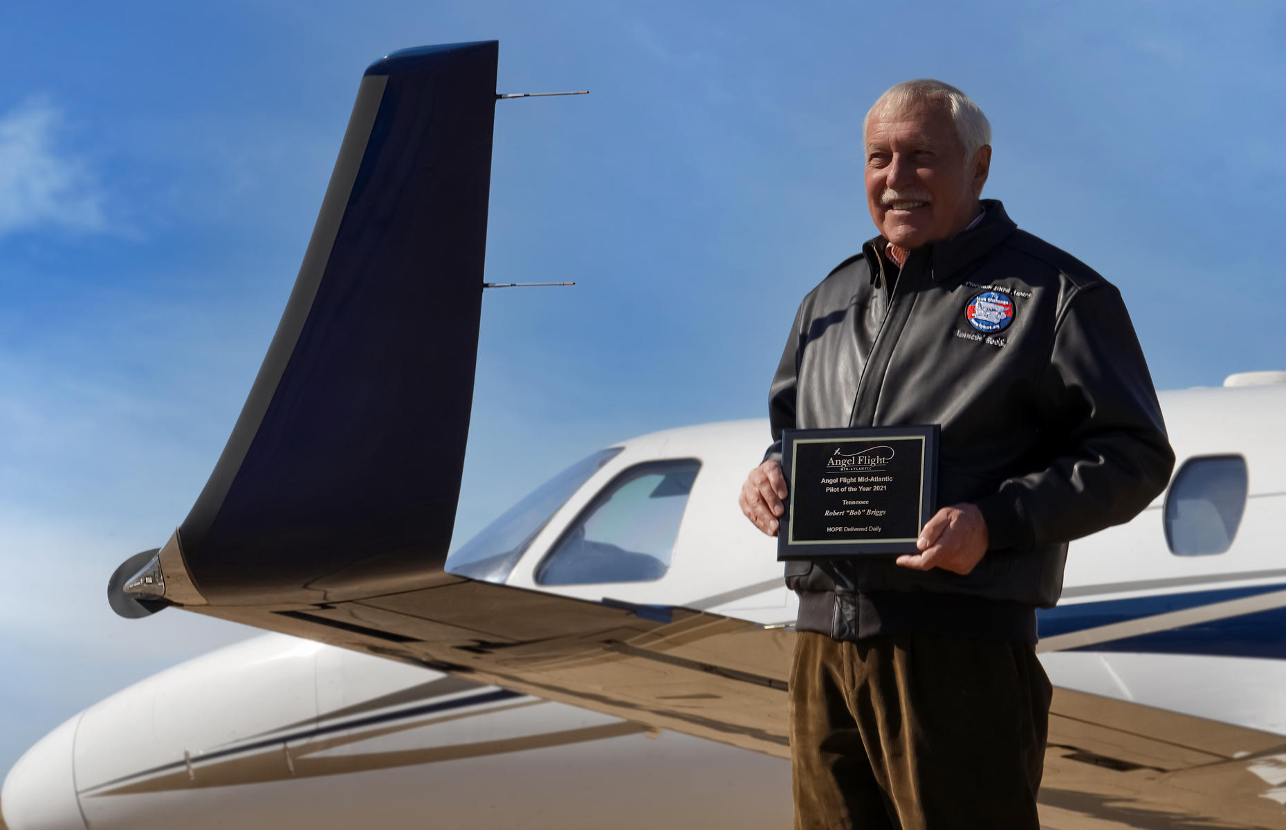 Bob Briggs with Angel Flight Pilot of the Year Award