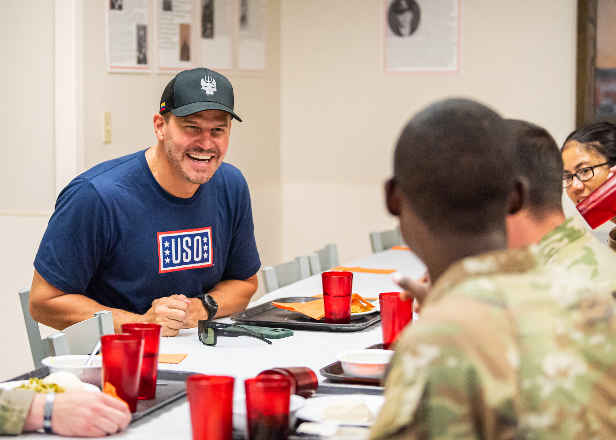 David Boreanaz shares a meal with service members during 2024 USO Entertainment tour to military bases in Missouri and Illinois