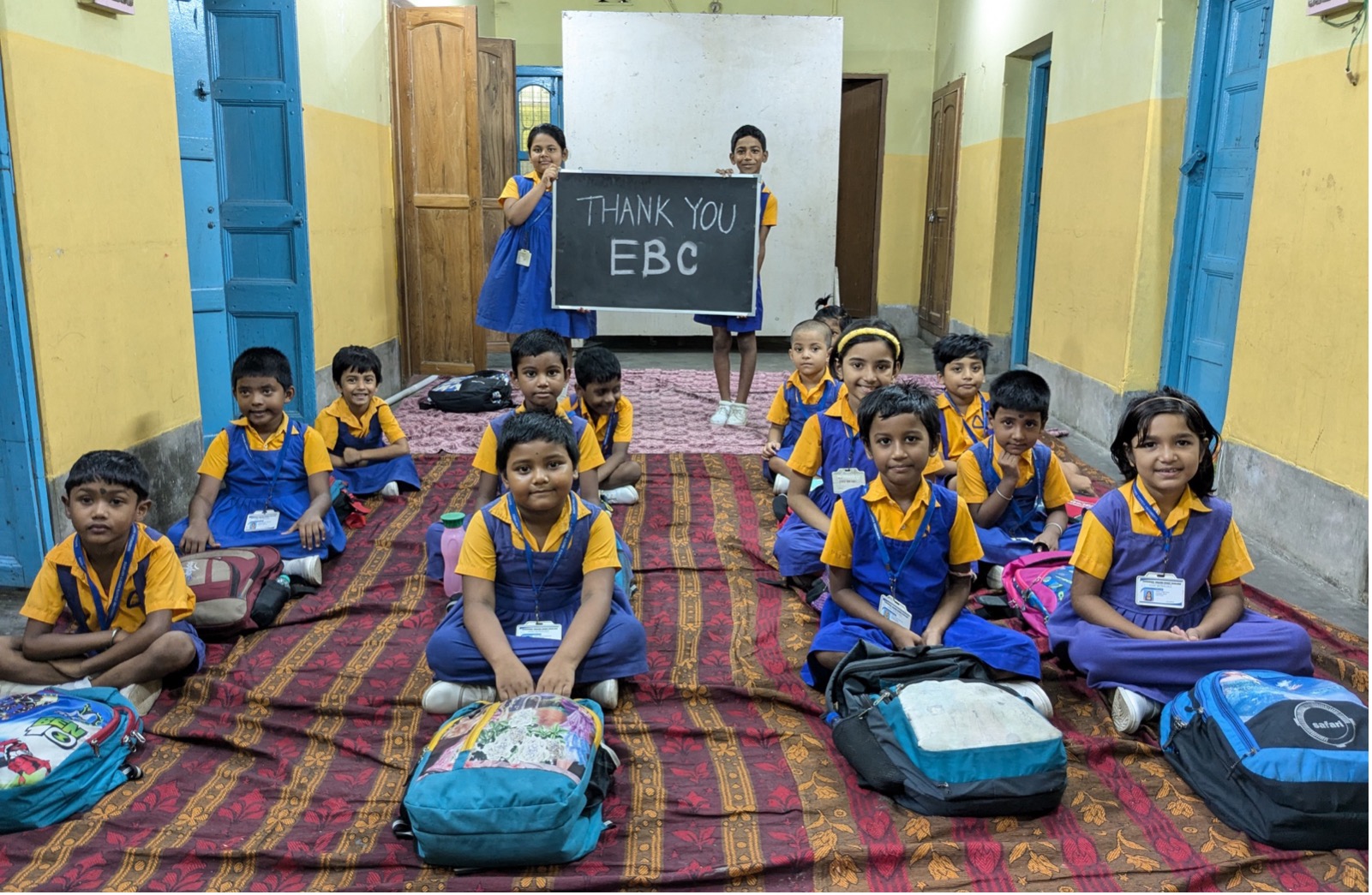 Grateful students at Ramakrishna Vedanta Vidyapith displaying a heartfelt thank you to EBC for their support. - EBC