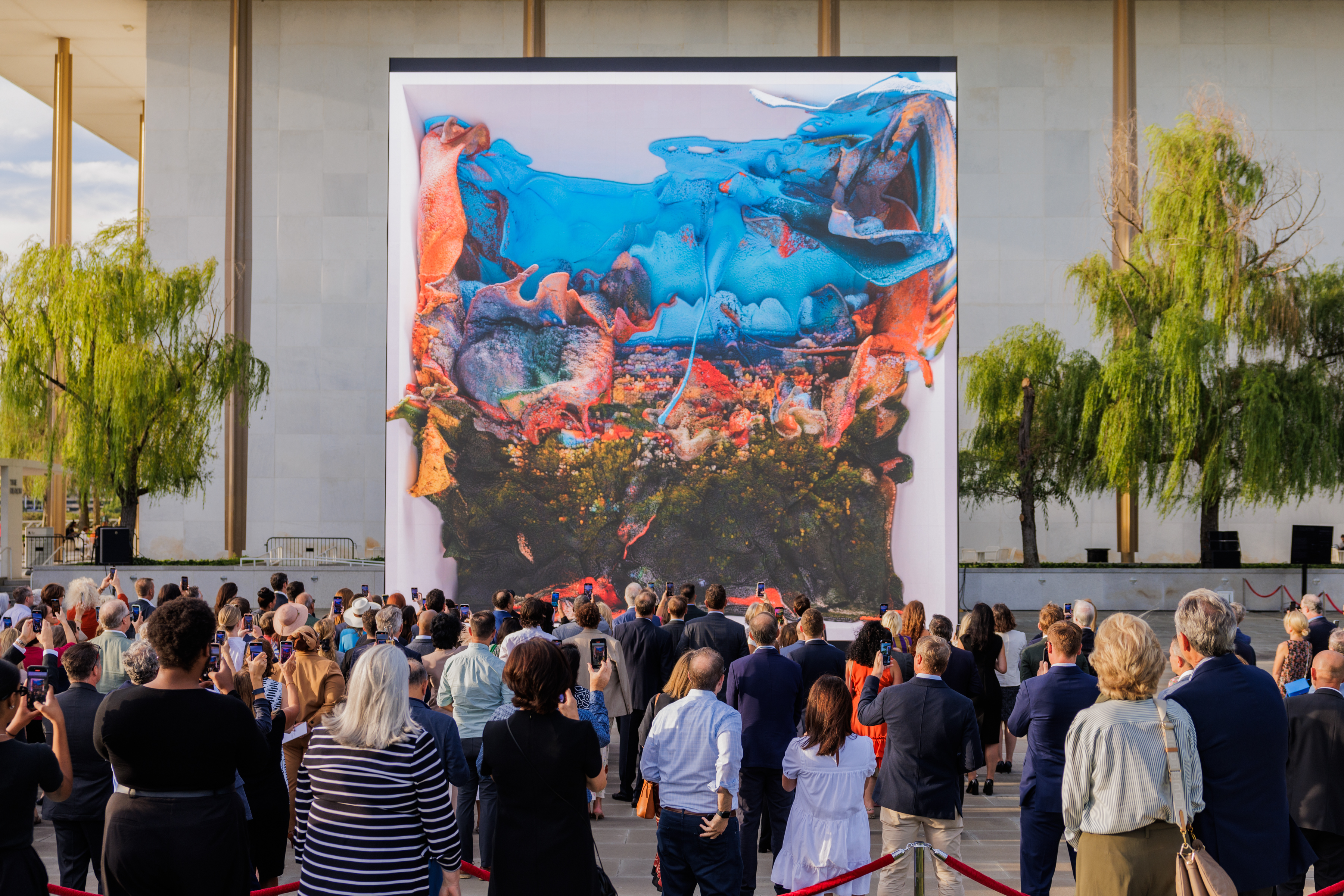 Visitors look towards Dvorak Dreams, a digital installation by Refik Anadol