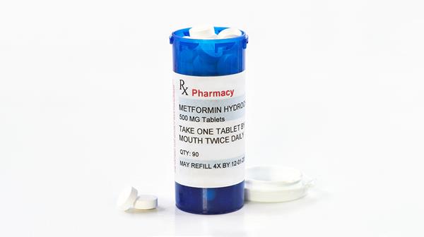 A prescription bottle with metformin (MedstockPhotos/Shutterstock.com