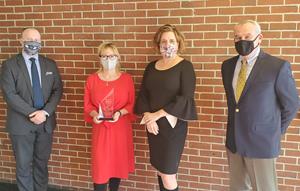 Infinity Federal Credit Union’s Business Services team accepts top SBA lender award at the credit union’s main office in Westbrook.