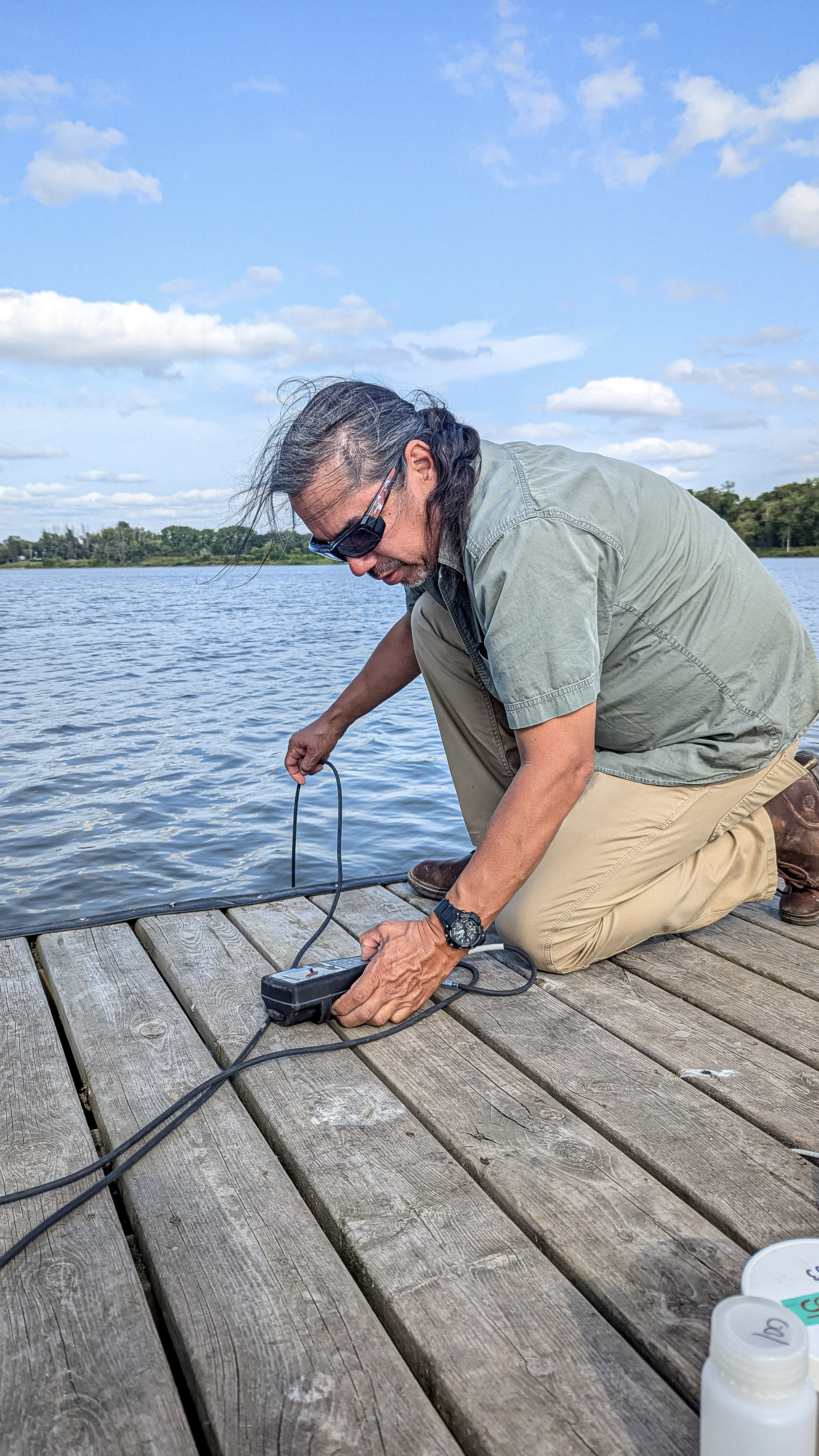 Water First Graduate conducts water monitoring in the field