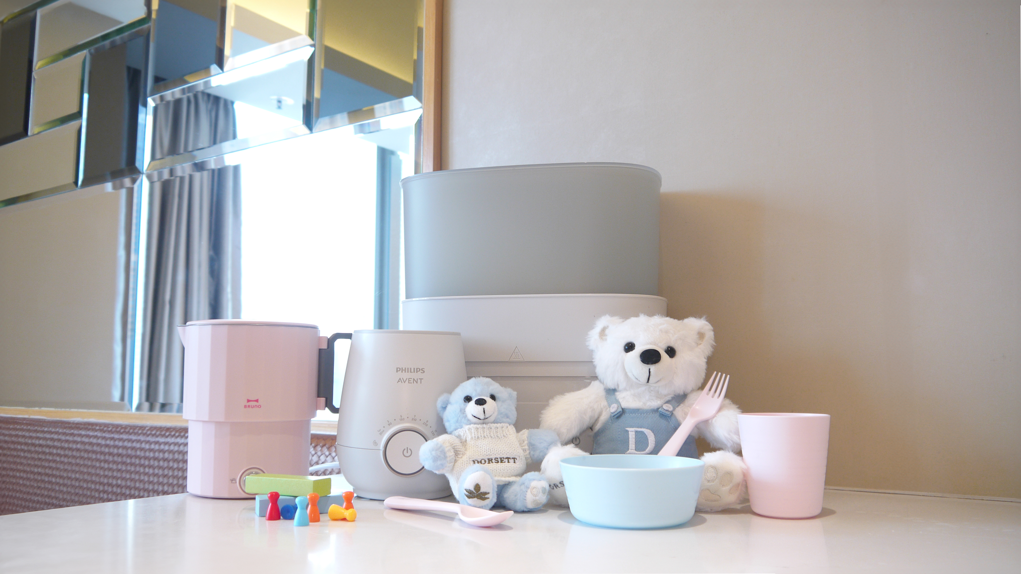 Family‑friendly room at Dorsett Mongkok with complimentary baby dining essentials, bottle warmer, and sterilizer.