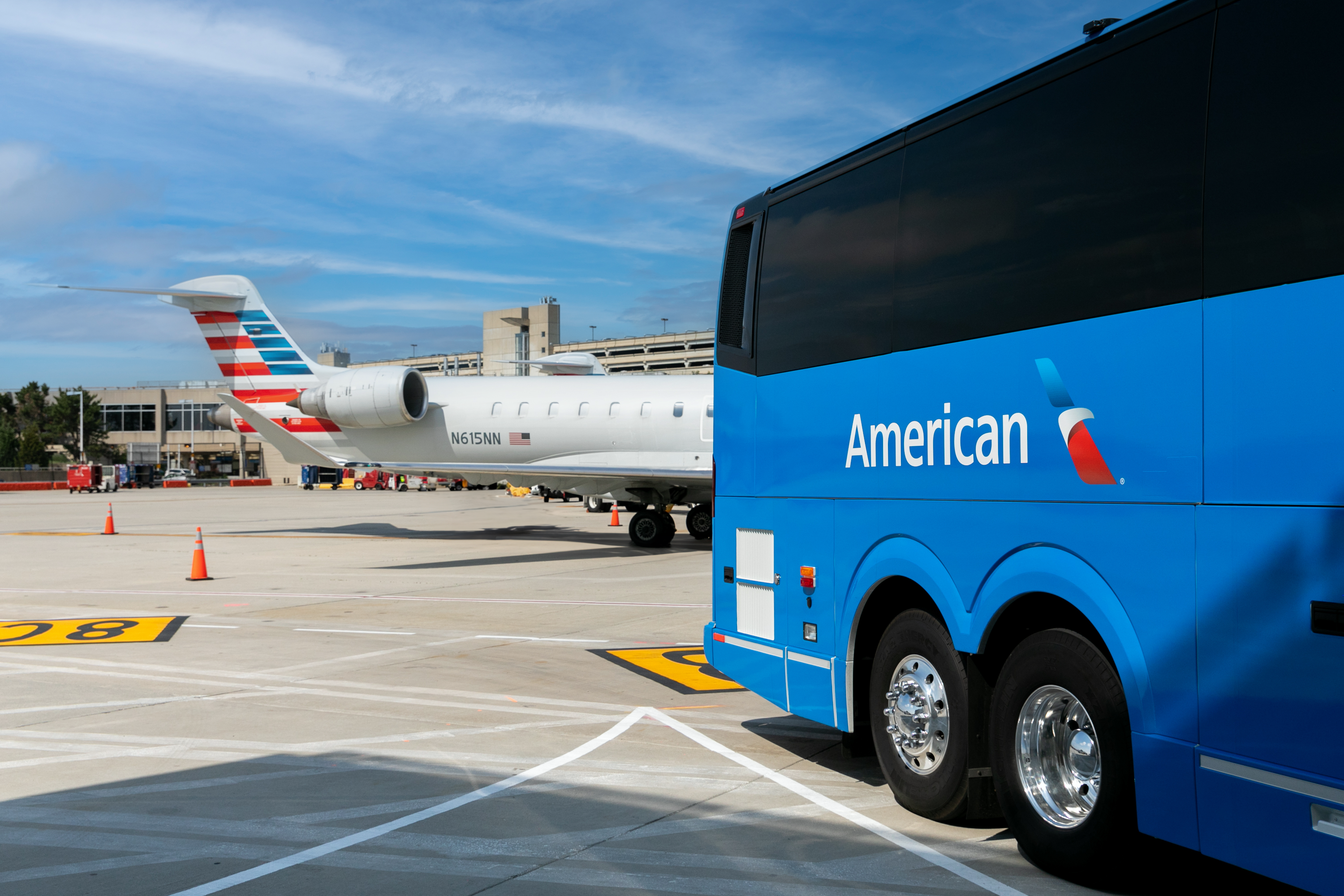 Landline Motorcoach with American Airlines Plane