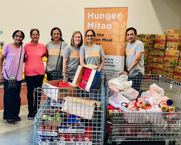 NTFB-IAC members stand with recently collected food items to donate to the North Texas Food Bank. The NTFB-IAC is launching the Second Annual Hunger Mitao Week by conducting a peanut butter and fund for food drives all over the region.