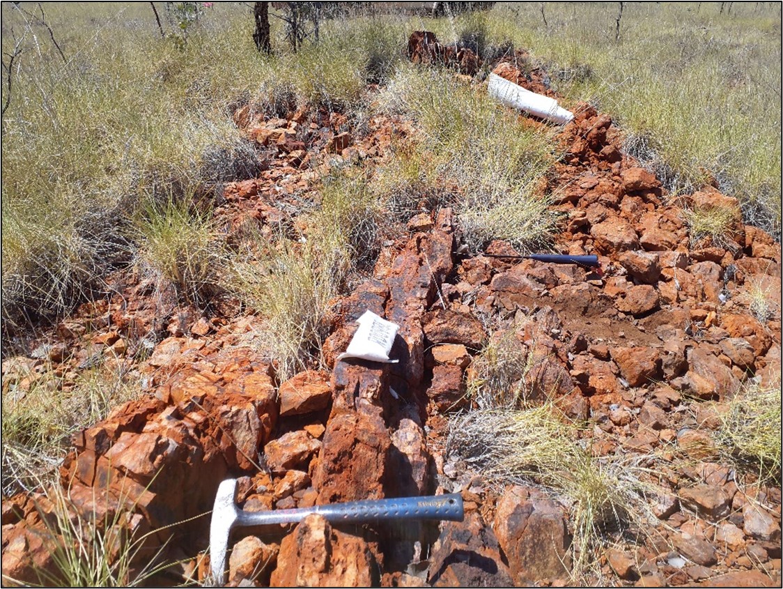 Mineralised gossan on the southern porphyry margin looking east. Sample R00988 (taken at the position of the central front sample bag) returned assays of 4.6 ppm Au, 99 ppm Ag, and <percent>1.4%</percent> Pb(4) .