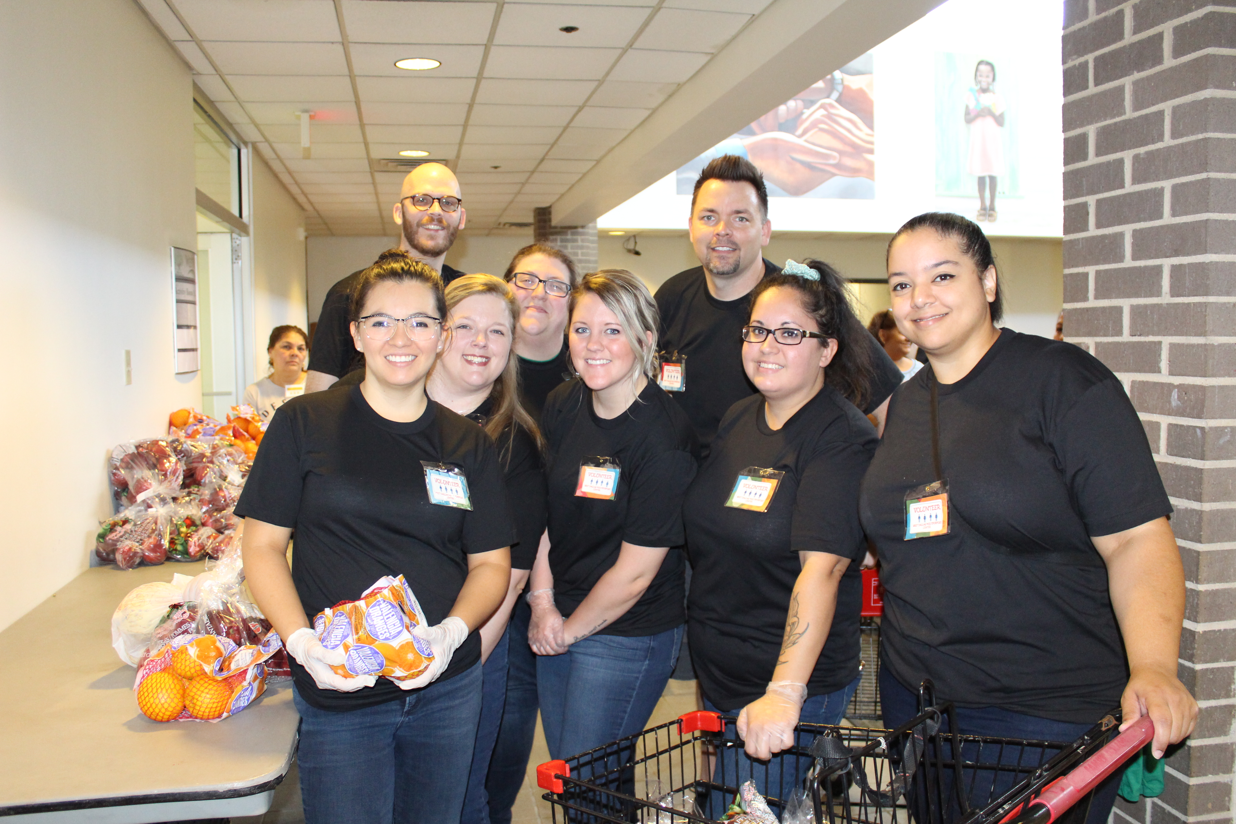 Starbucks employees volunteering at a Mobile Pantry Distribution in September 2019 in honor of Hunger Action Month. The recent grant Starbucks gave will support the Mobile Pantry Program in the North Texas Area.