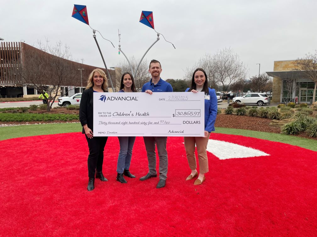 Advancial presents donation check at Children's Medical Center Plano