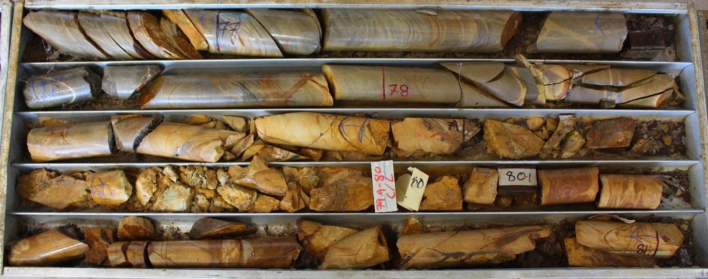 MD07 from 76.9 m – 81.0 m. The limonite rich puggy fault breccia represents the NW Fault 4 mineralised structure returning 2.1 m @ 3.82 g/t Au from 78.9 m, including 0.6 m @ 9.74 g/t Au. Elevated arsenic, antimony, bismuth, molybdenum and tungsten accompany this interval.