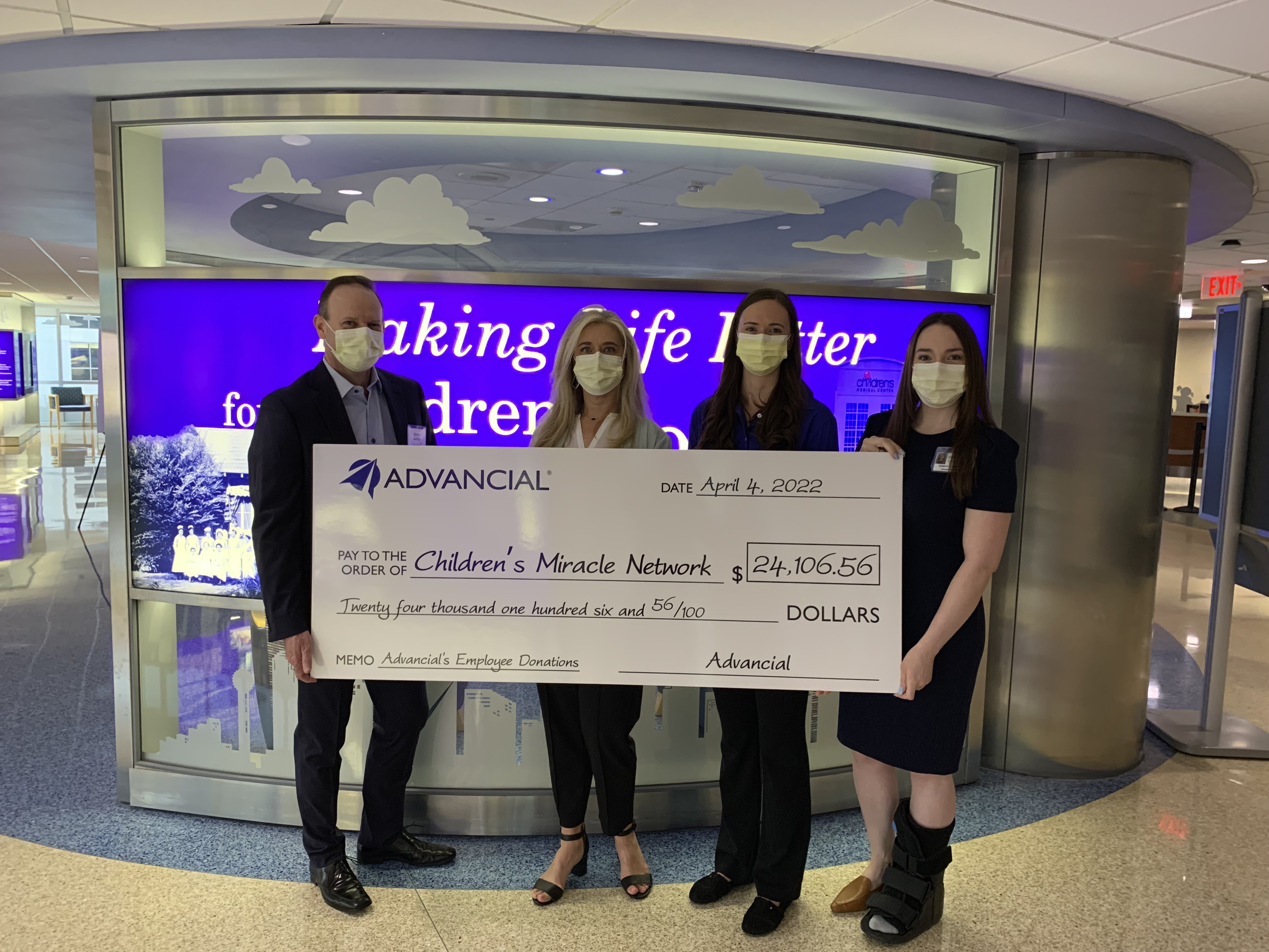 From left to right, Brent Sheffield, President & CEO, Deborah Griesbach, CMO, and Hannah Paxton, Employee Development Analyst, from Advancial presented a check for $24,106.56 to Kendall Rowden, Children's Medical Center Foundation's Development Officer, at the Children's Health's Dallas campus on Monday morning.