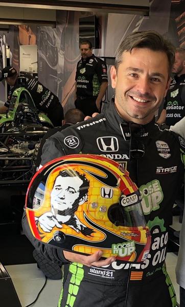 Oriol Servia holding his unique helmet designed for the 103rd Running of the Indianapolis 500. COAST family and friends will be rooting on Servia, the newest addition to the COAST Advisory Board, who will be driving car number 77 this Memorial Day Weekend.

