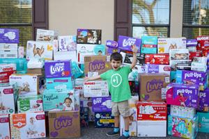 T.J. set a goal to collect 100 boxes of diapers by Thanksgiving. With the help of family, friends and local businesses, he ended up with 162 boxes (more than 14,800 individual diapers).