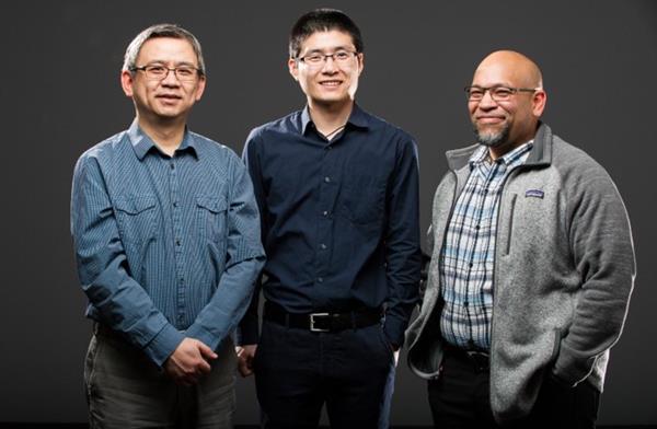 NREL scientists Kai Zhu (left), Fei Zhang, and Joseph Berry figured out a way to sequester lead if a perovskite solar cell is damaged. Photo by Dennis Schroeder, NREL