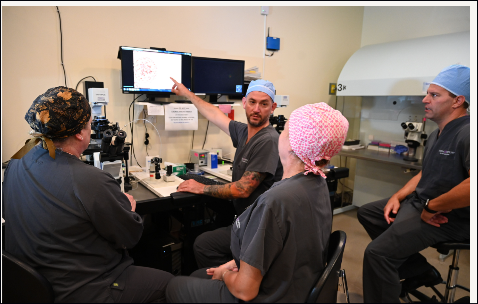 Dr. VerMilyea discusses Presagen’s Life Whisperer AI software with Ovation lab team members and Ovation Chief Executive Officer Paul Kappelman (right). 