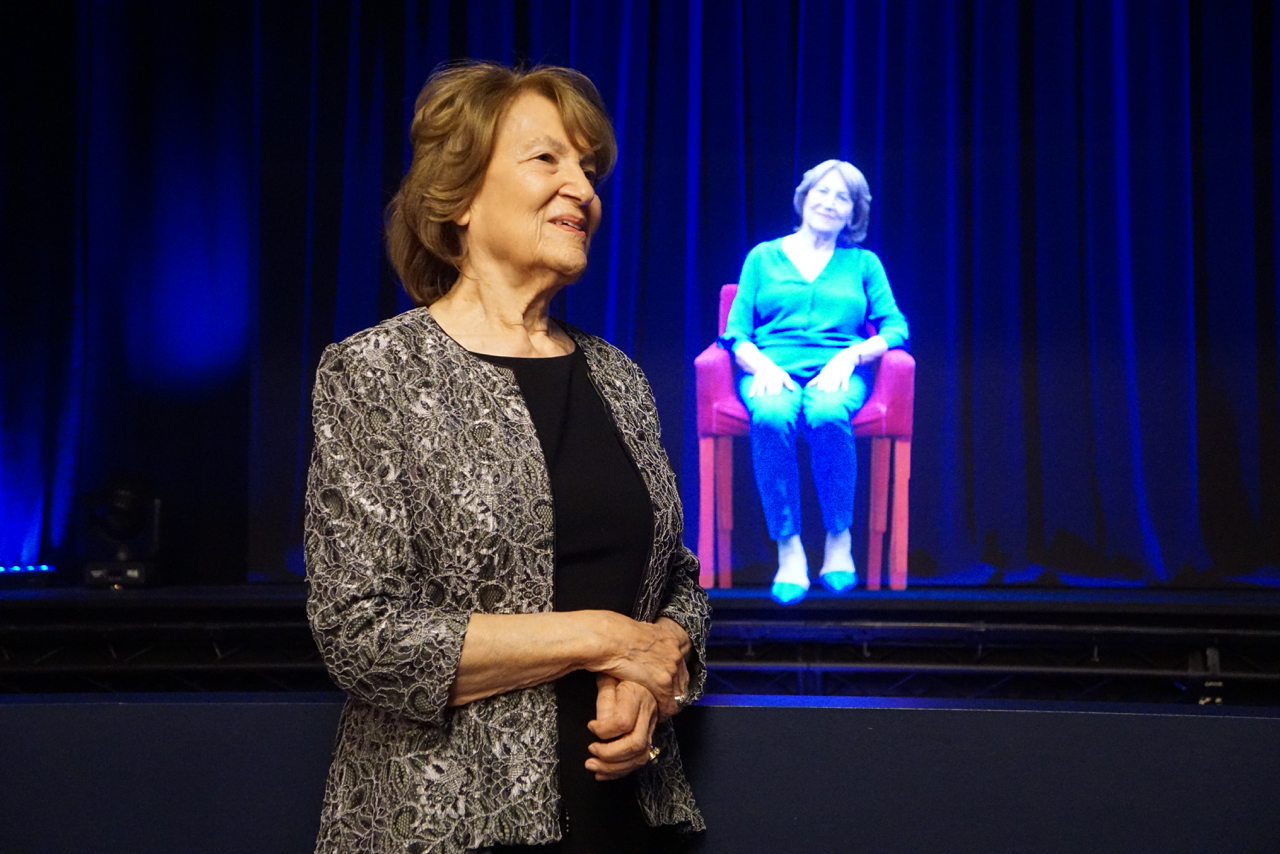 Fritzie in front of her hologram in Illinois Holocaust Museum's Survivor Stories Experience.
(photo credit: Ron Gould)
