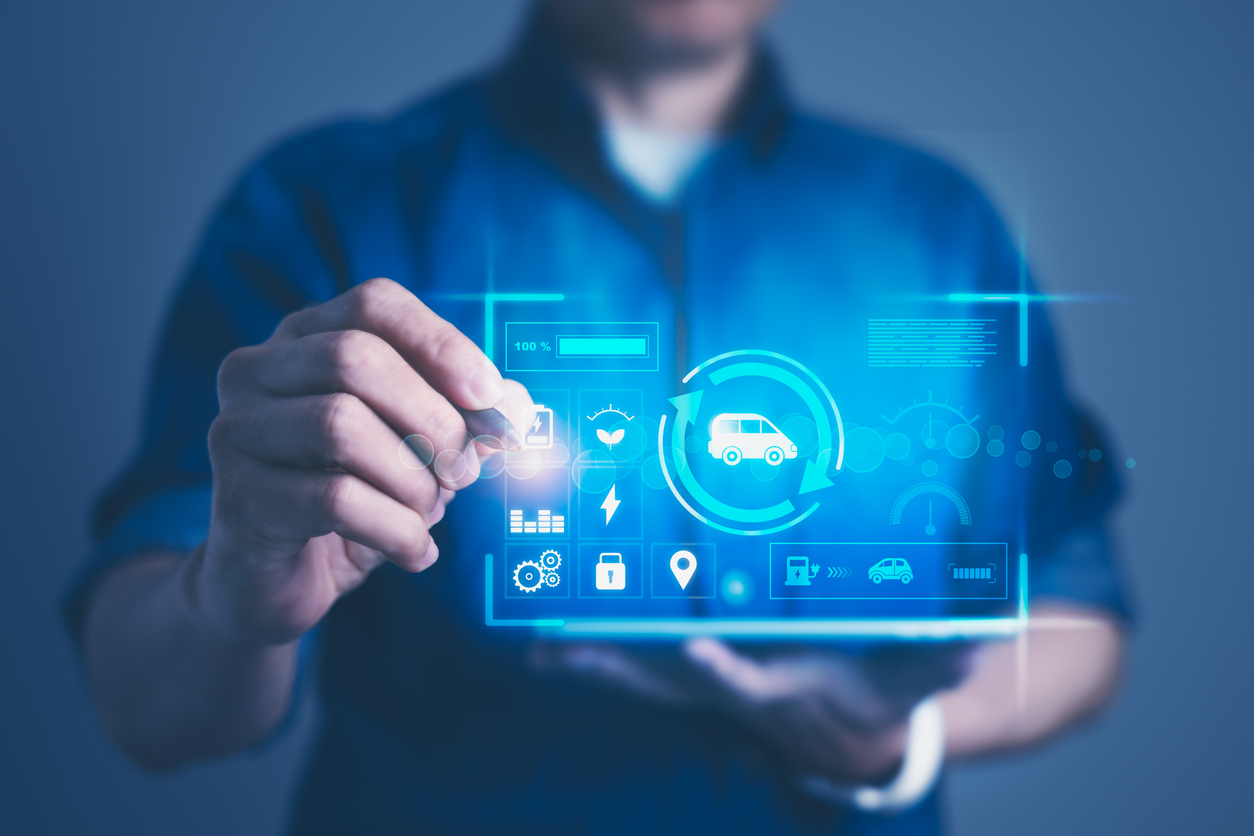 A fleet driver interacting with a smartphone displaying fleet charging status