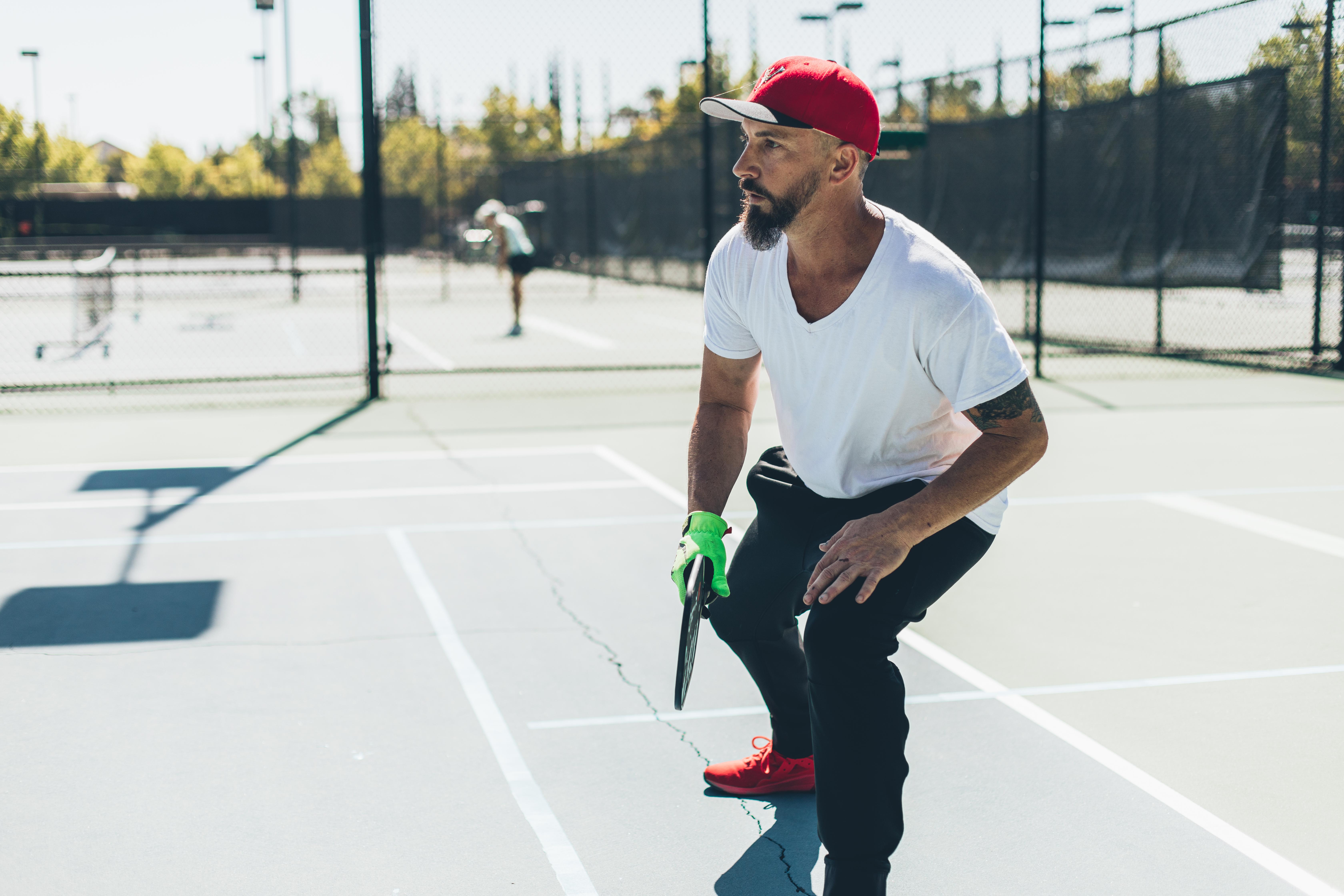 Player enjoying one of the outdoor pickleball courts at In-Shape Health Clubs.