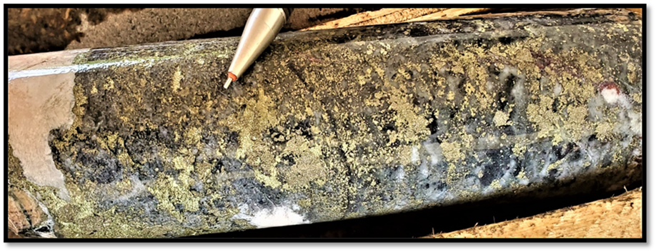 Blebby pyrite+chalcopyrite within quartz brecciated magnetite vein containing late coarse calcite proximal to increased mineralization within TH21-7 @72.50m. Sample# 42580 containing 3.42% Cu, 0.75g/t Au, 7.03g/t Ag and 1.13ppm Mo over 0.50m.