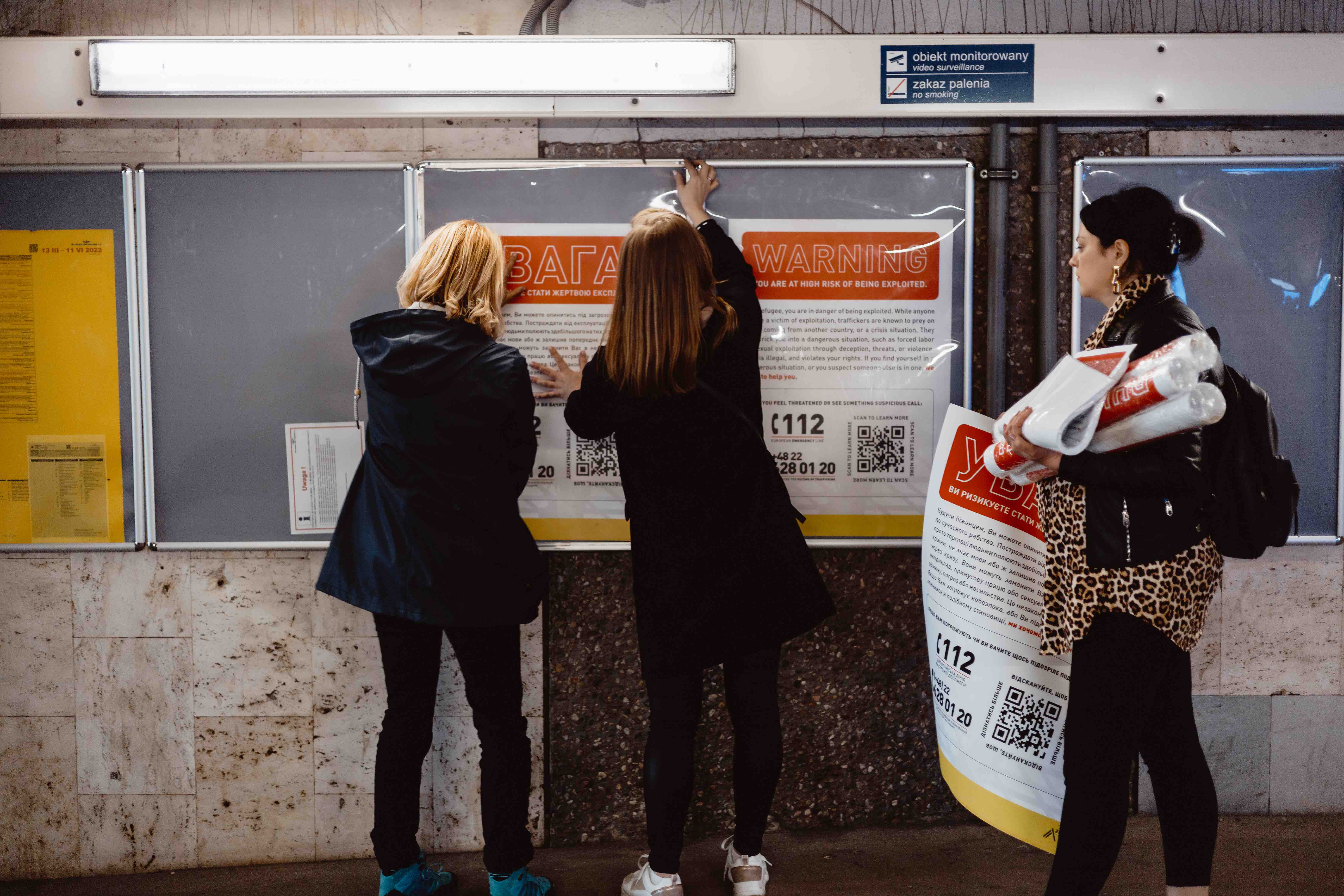 Team Members Displaying A21 Trafficking Prevention Resources in Warsaw