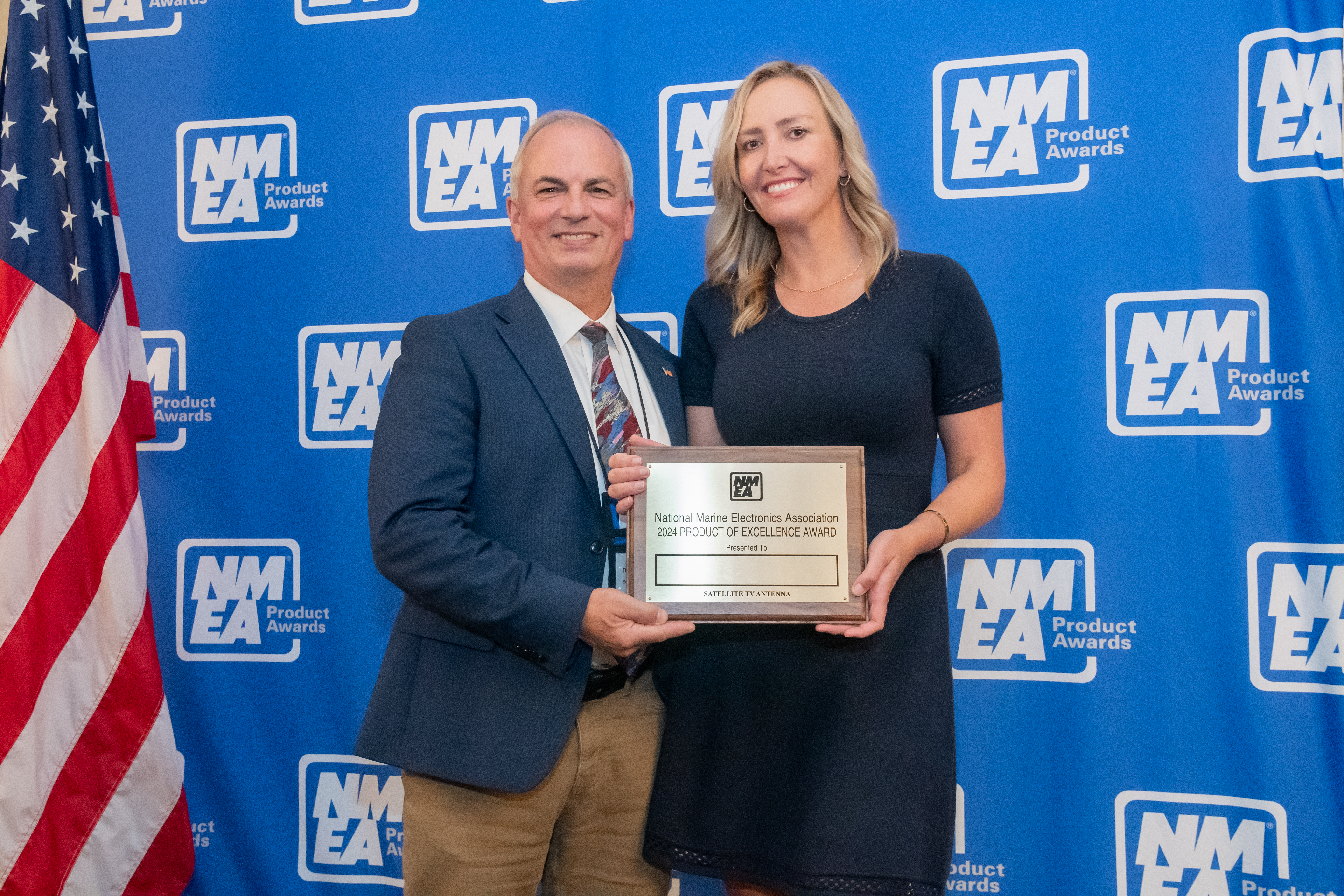 Alexandra Mouligne, Program Manager, KVH Superyacht Group, receiving the award from Tim Banaszak, member of the NMEA Board of Directors