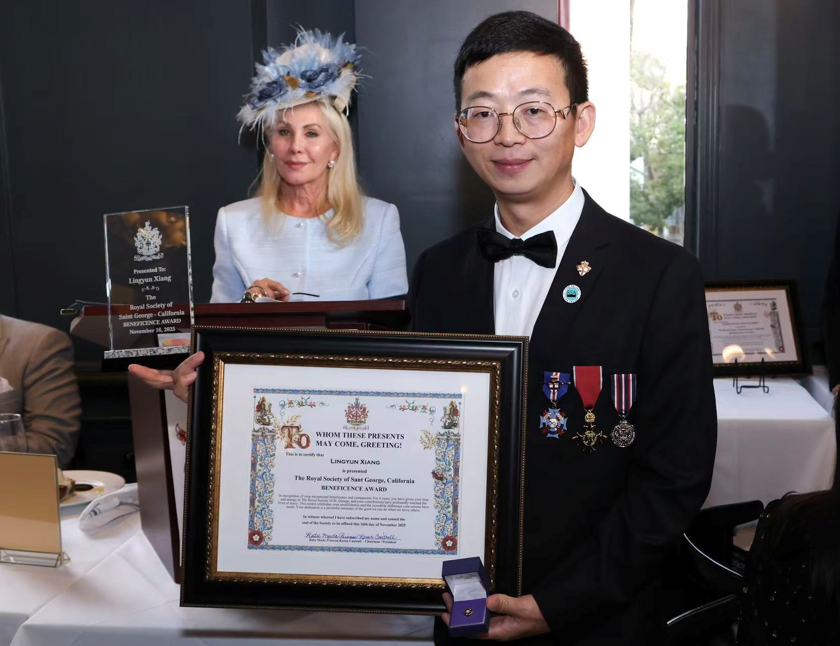 Princess Karen Cantrell presents the prestigious Beneficence Award to Dr. Lingyun Xiang during the ceremony