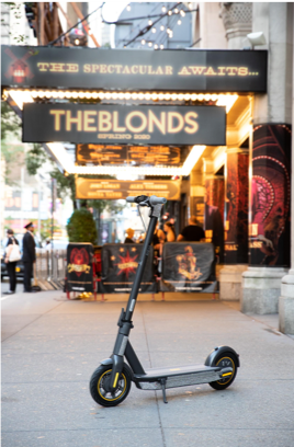 Ninebot MAX outside of Moulin Rouge ready for The Blonds S/S 2020 fashion show. Photo Credit: Zilan Fan