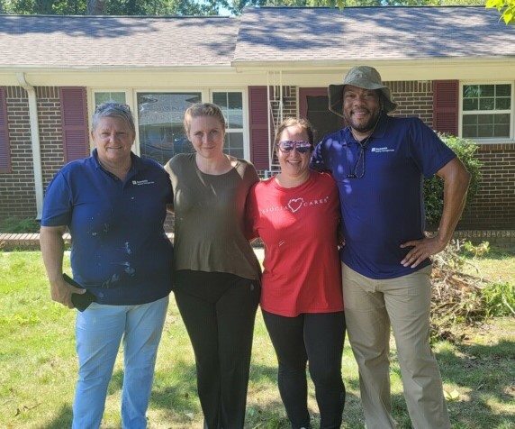 Associa McKay Management team members recently volunteered at Habitat for Humanity