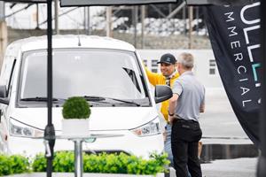 Photo: Sept 18, 2023, Dover Motor Speedway. Mullen staff and consumer discuss Class 1 EV cargo van