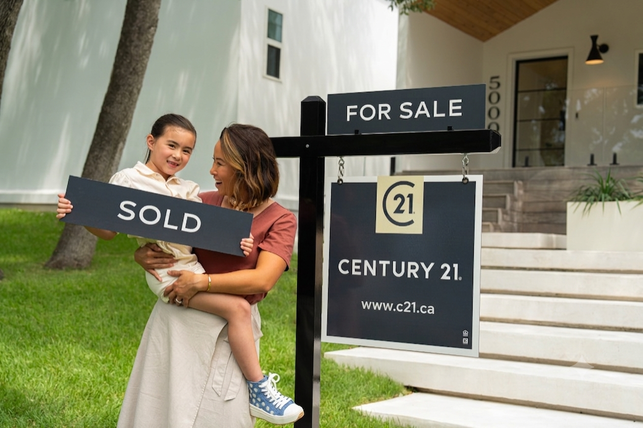 Century 21 Canada sign with buyer