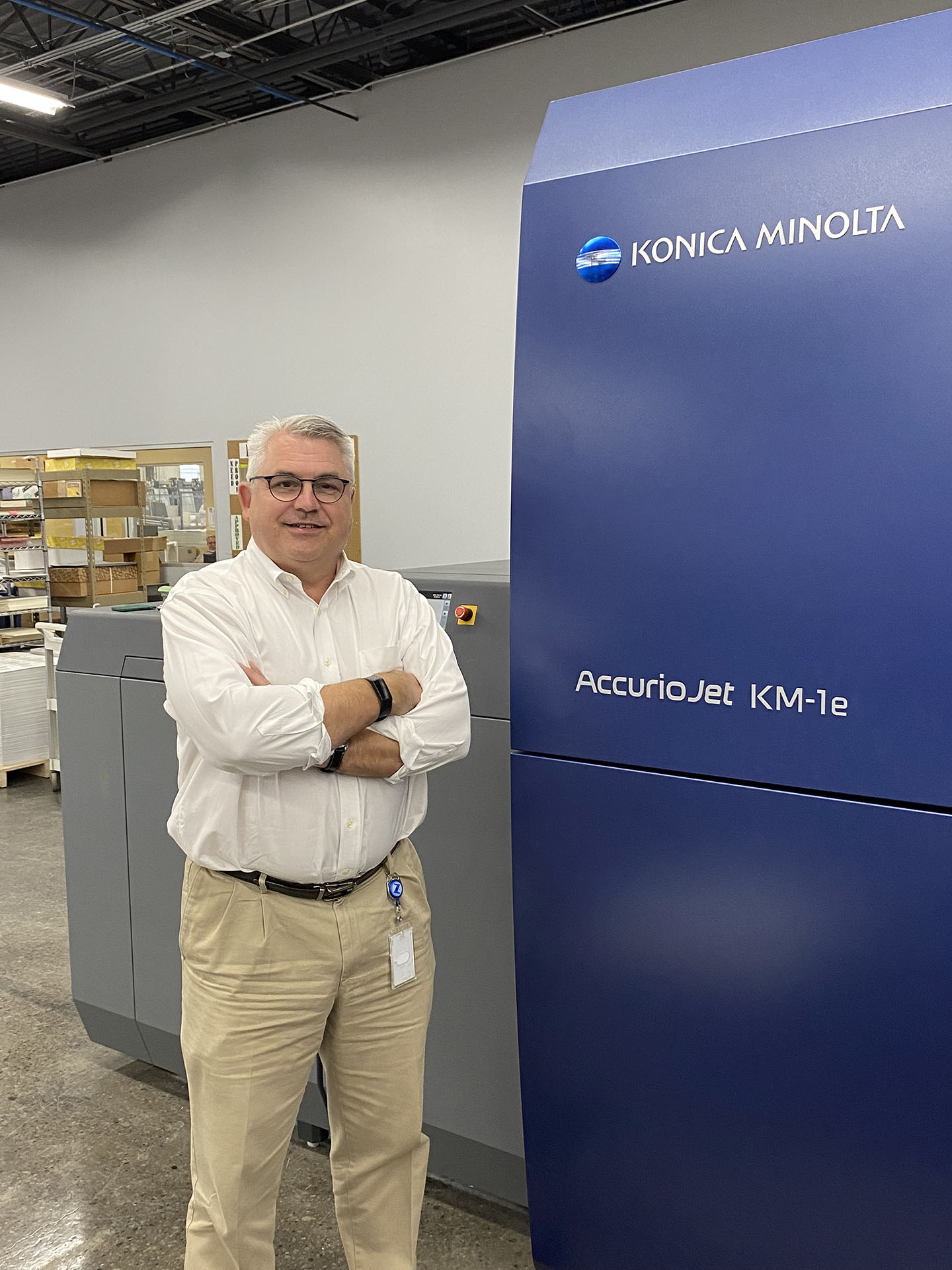 Steve Zenger, CEO of Zenger Group with its newly installed Konica Minolta AccurioJet KM-1e LED UV Inkjet Press