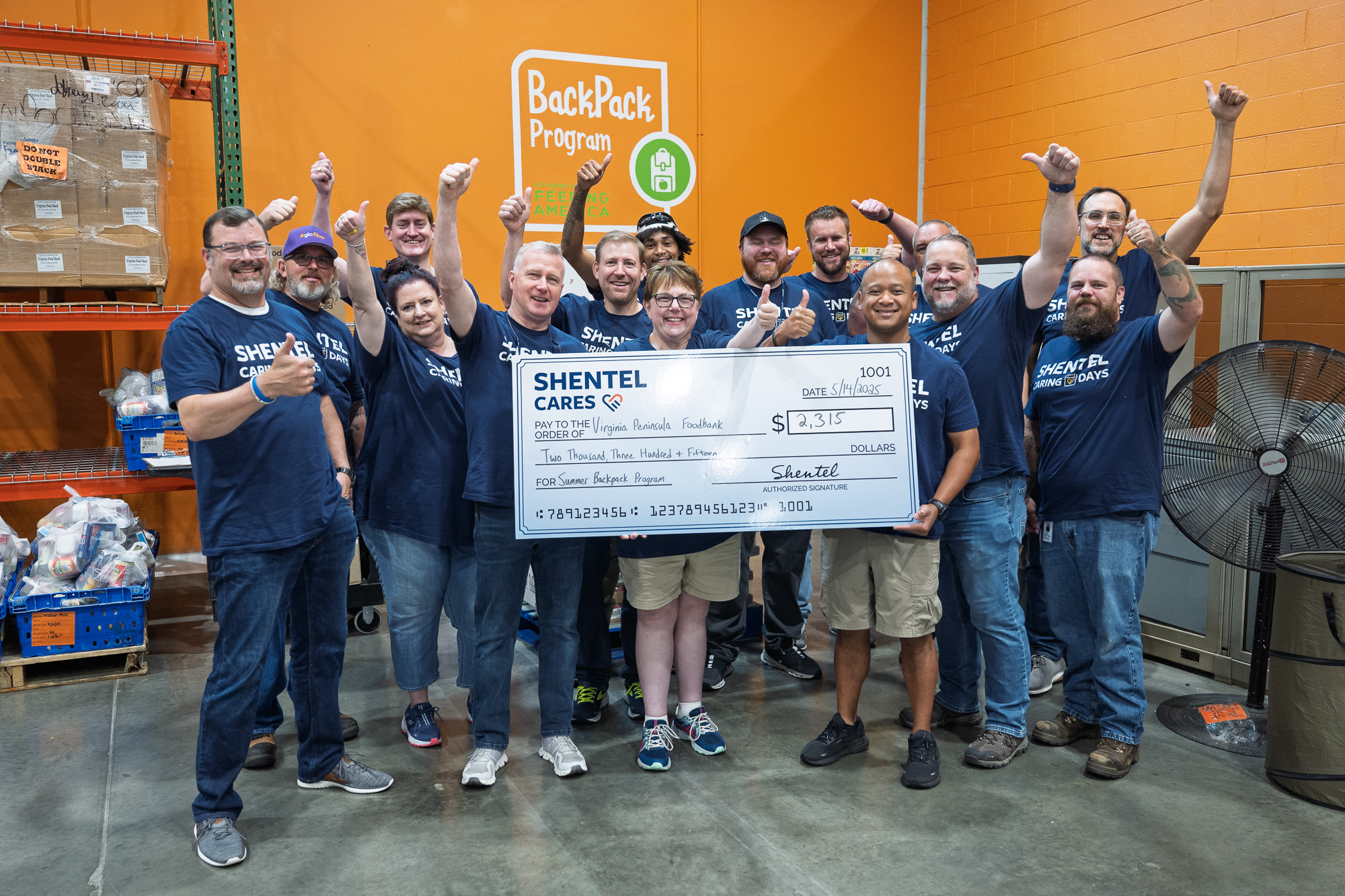 The Shentel Team taking a donation check to Virginia Peninsula Foodbank.
