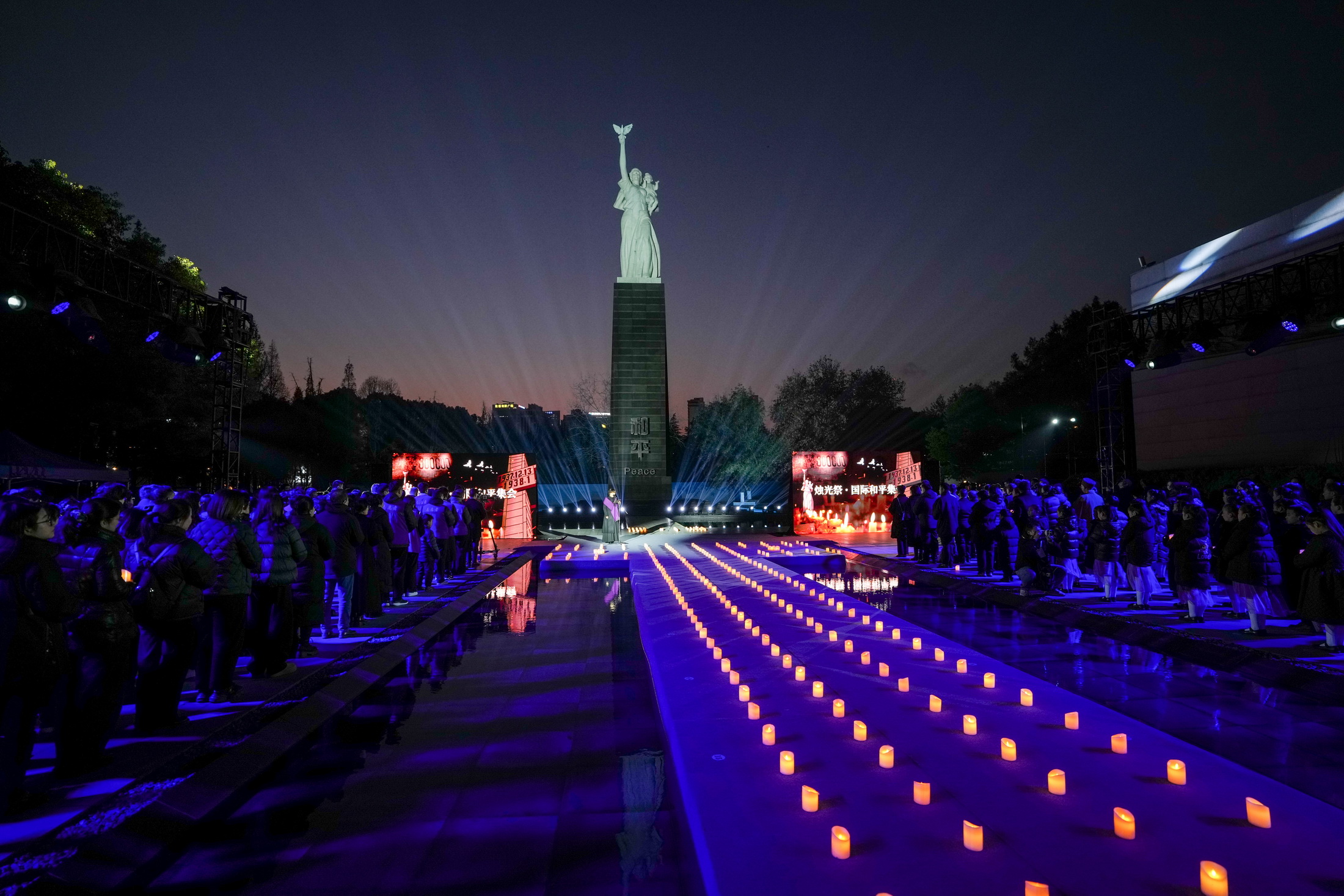 People take part in a candlelight vigil at the Memorial Hall of the Victims of the Nanjing Massacre by Japanese Invaders, Dec.13, 2025