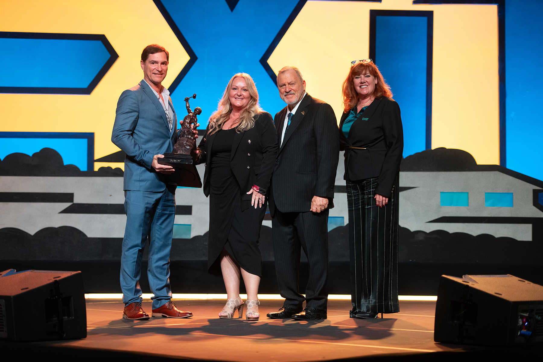 From L/R - Regional Owners, Greg and Lynn Findlay with EXIT Realty Founder & Chairman, Steve Morris, and EXIT Co-Chair, Tami Bonnell.