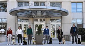 Six SPA employees with Future Guide and Service Dog Puppies