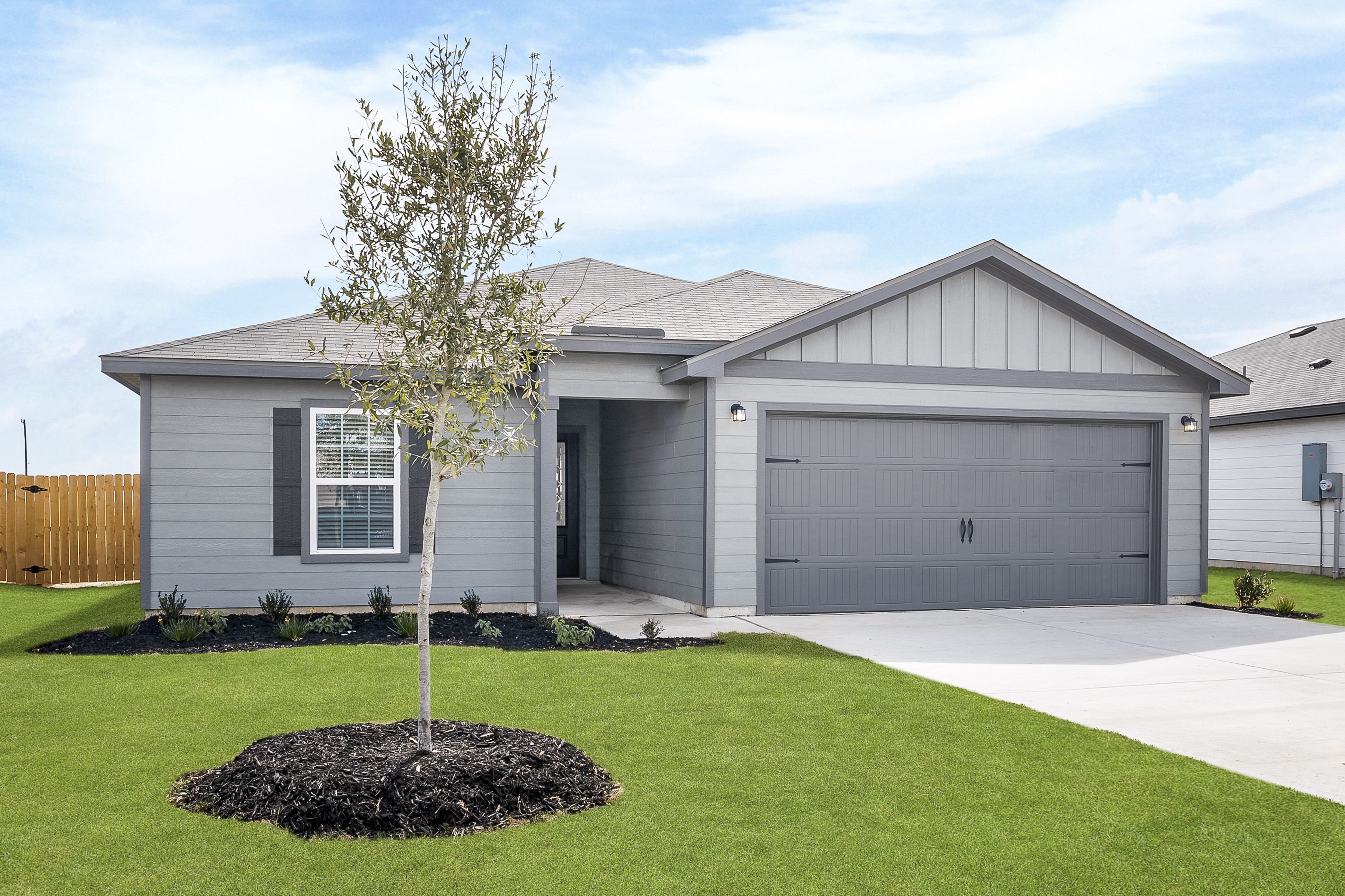 The Conroe at LGI Homes features a gorgeous exterior and professional front yard landscaping.