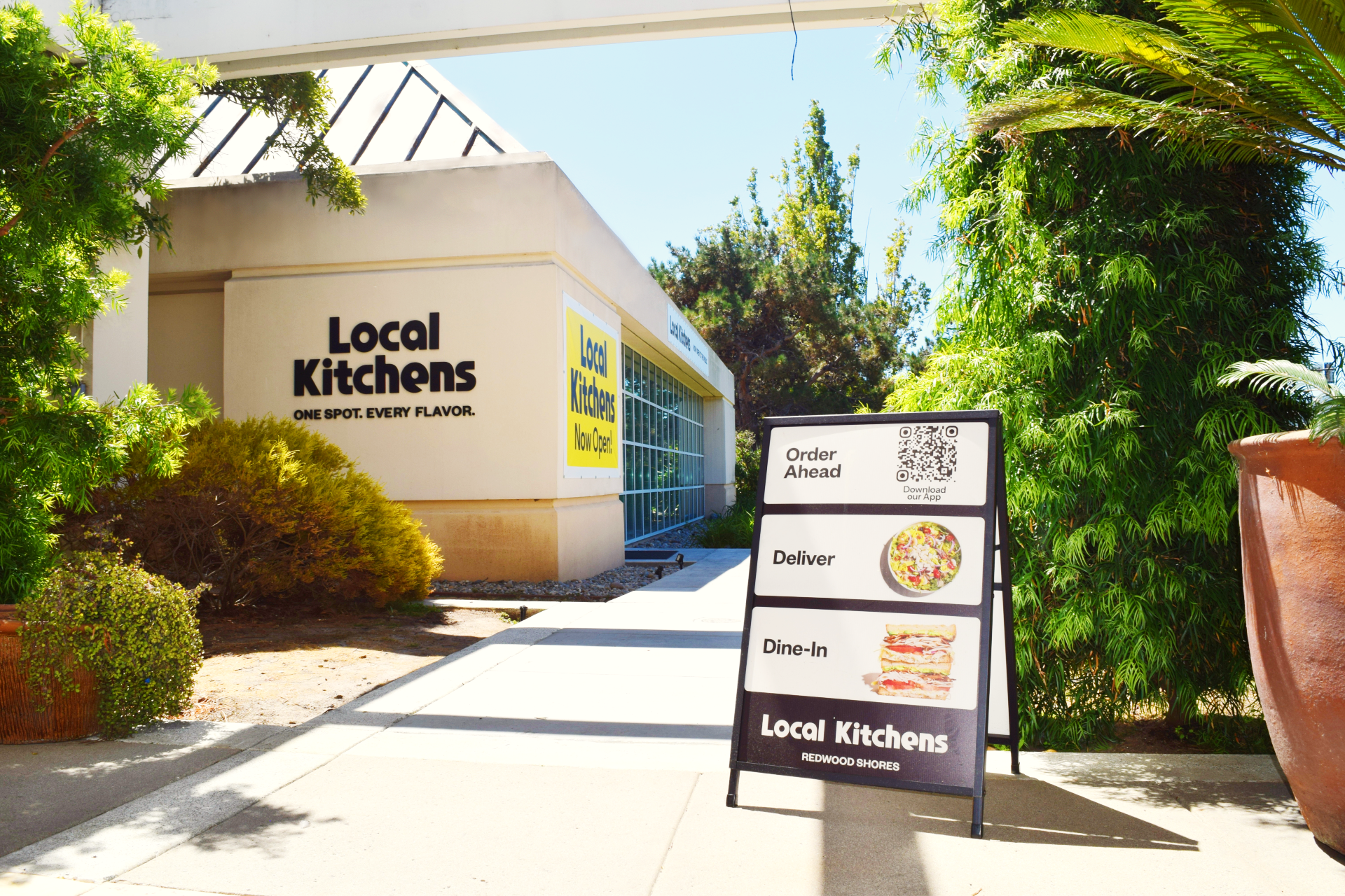 A sandwich board menu with many offerings outside of the new Local Kitchens location at Bay Club Redwood Shores.