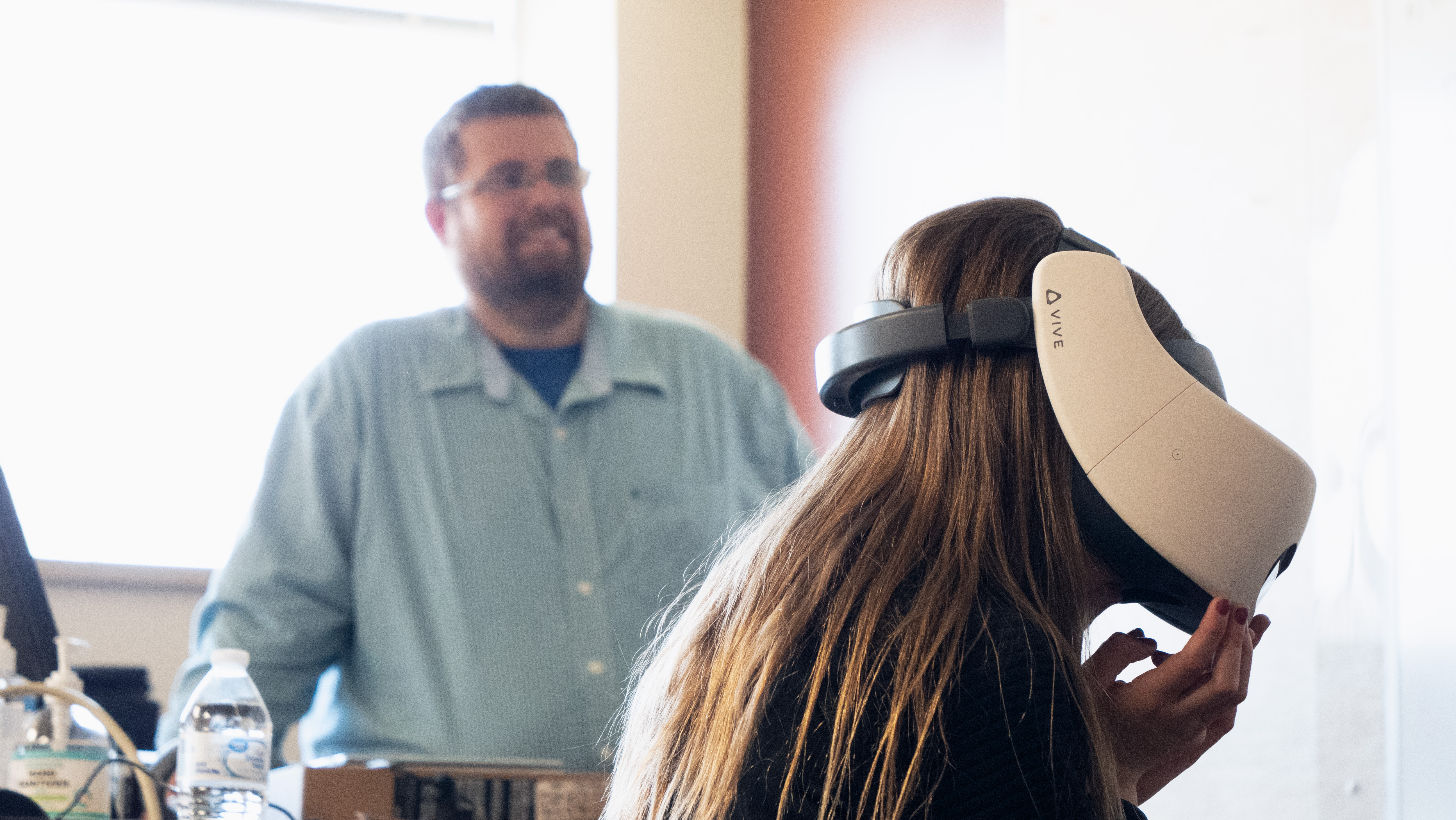 North Dakota's legislature approved funding in 2023 to allow the state's career and technical education programs to implement virtual reality career exploration software across the state. Students have access to CareerViewXR, an immersive career exploration platform, to explore field trips and job shadows highlighting in-demand industries like skilled trades, healthcare, energy, and more. CareerViewXR Cofounder and CEO Matthew Chausee watches as a student uses the CareerViewXR platform on a VIVE Focus Plus virtual reality headset. CareerViewXR is gifting the headsets made by HTC VIVE to all public and private middle and high schools in North Dakota.