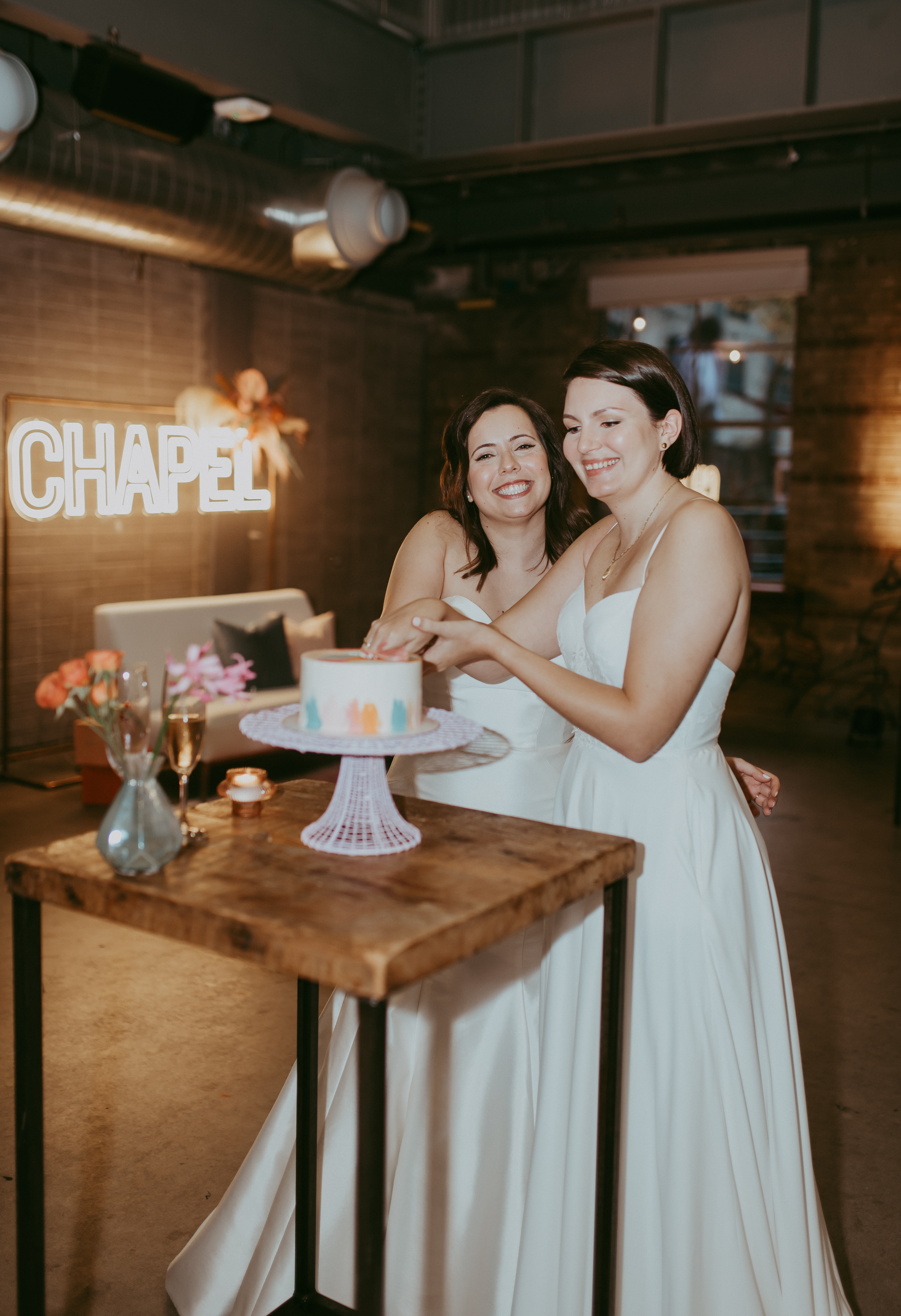 Couple cutting cake at the Pop Up Chapel