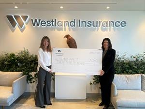 Westland's CPO, Keri Fraser, presents the donation to Second Harvest's Head of BC Operations, Shelley Lycan.