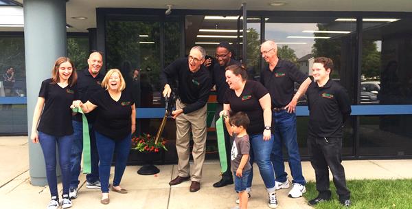 Ken Barton (center) at the grand re-opening of his Minuteman Press printing franchise in Dublin, Ohio. https://minutemanpressfranchise.com