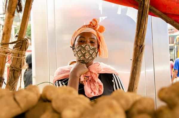 Hanna L* at her vegetable stand, works to provide for her family after receiving start-up funds through local Compassion partners in Ethiopia. Once jobless, her young family now thrives, despite the challenges of the pandemic.
