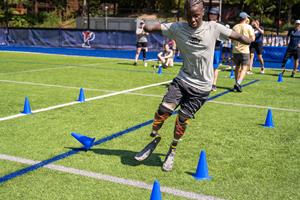 Chase Merriweather learns mobility skills at the Össur & CAF Running and Mobility Clinic in Philadelphia